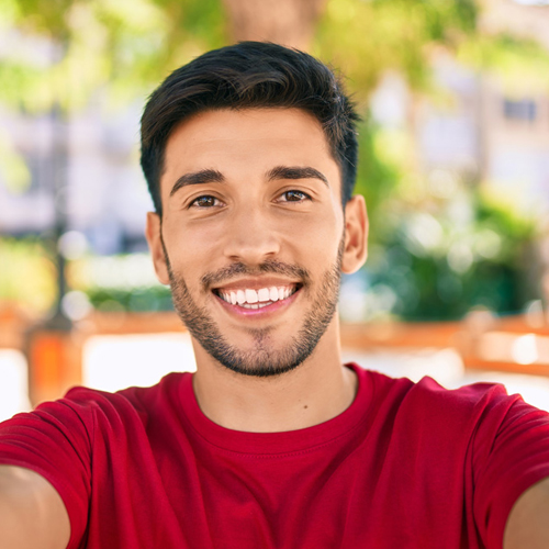 male student smiling at the camera male student smiling at the camera
